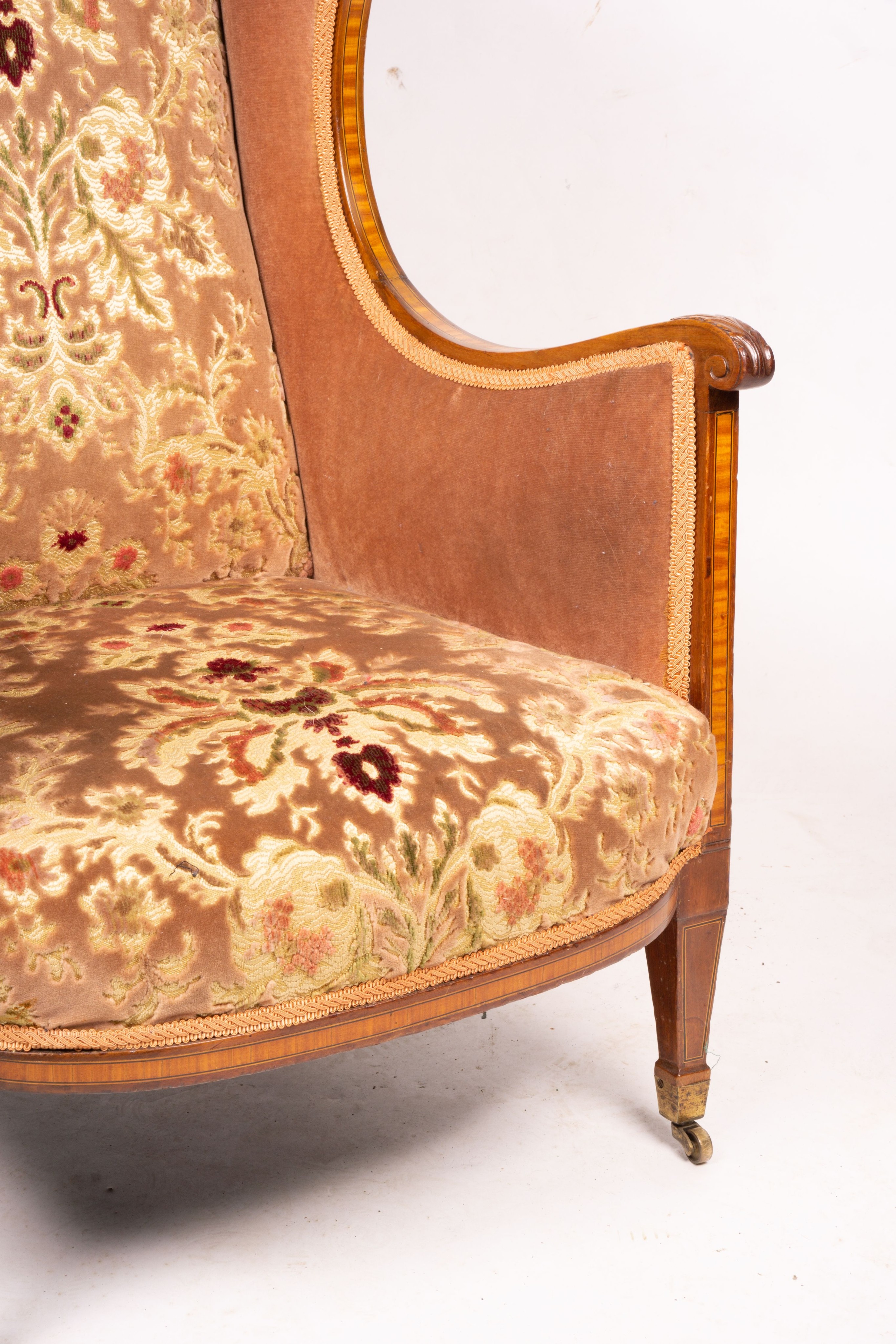 A pair of Edwardian satinwood banded mahogany wing armchairs, width 56cm, depth 75cm, height 110cm